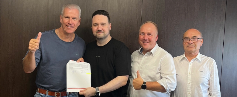 Photo of the signed contract between representatives of profine GmbH and LINKIN Ltd